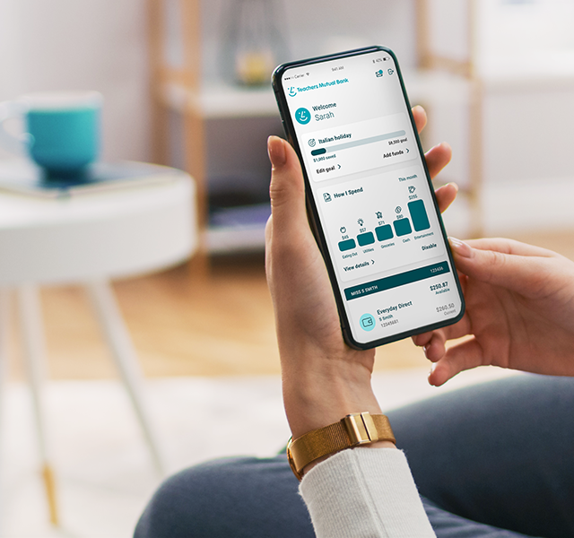 A woman looks at her accounts on the Teachers Mutual Bank app.