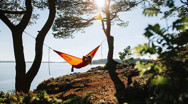 Lady in a hammock between trees