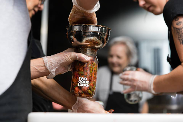 Staff testing packing the Two Good Foods pickles