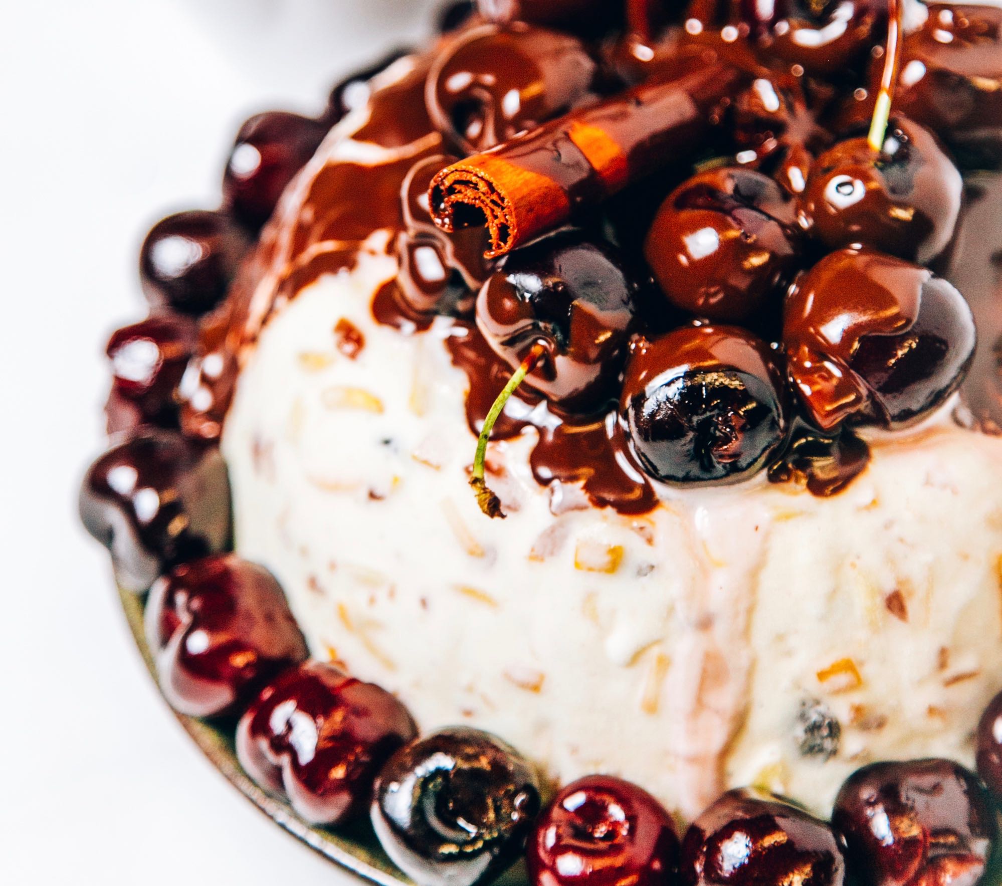 Frozen ice cream christmas pudding with glazed cherries