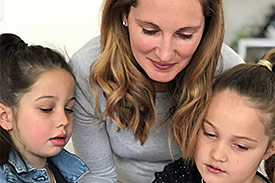 Female teacher with young students