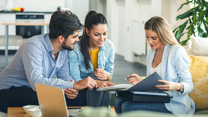 financial advisor meeting with couple