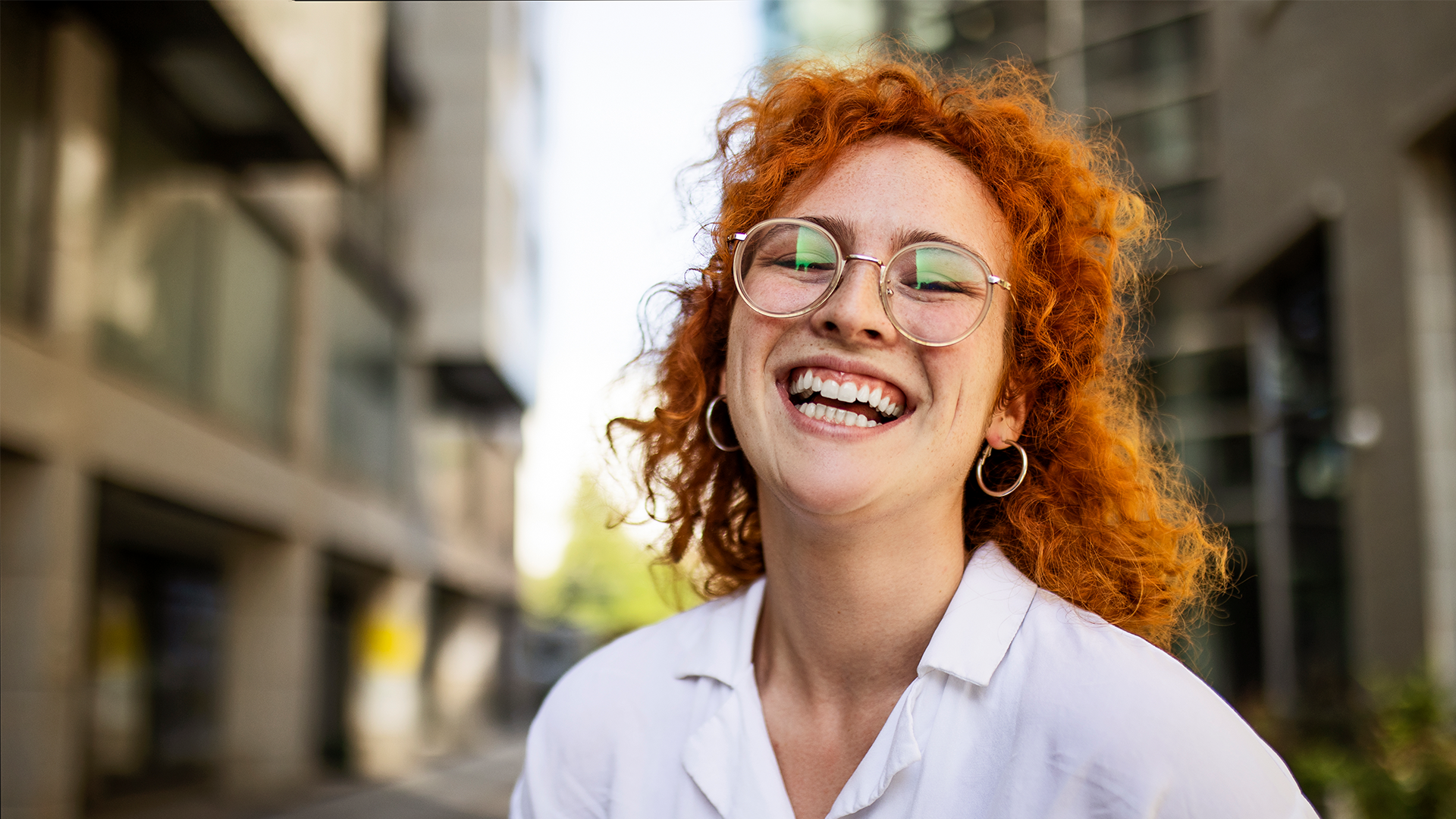 Lady smiling in the street