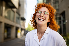 Lady smiling in the street